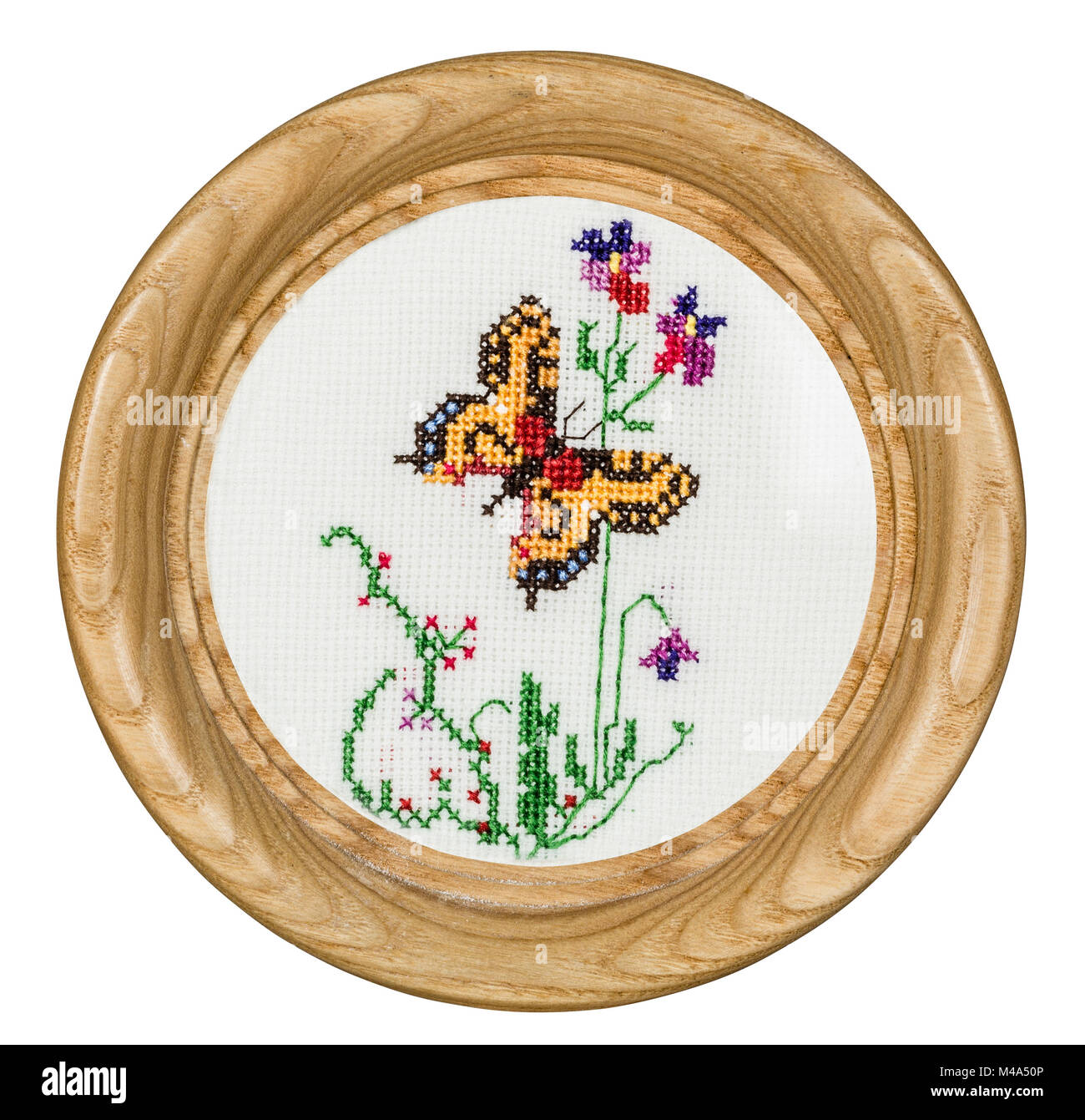 Embroidered picture in the frame, isolated on white background Stock