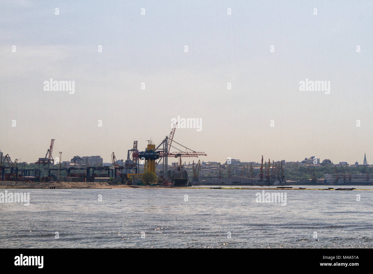Cargo crane ship and grain dryer in port Odessa Stock Photo