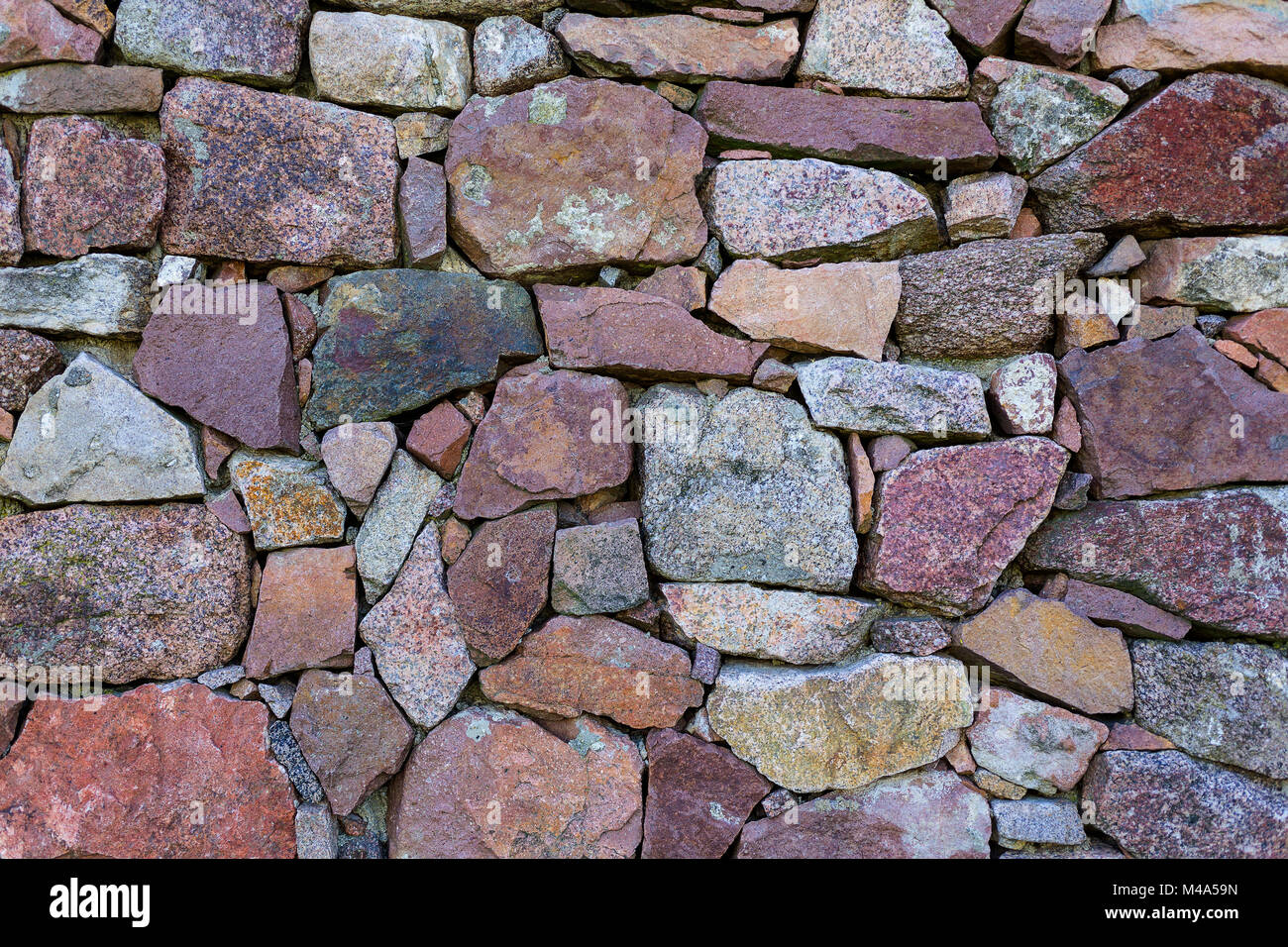 Drystone wall,stones in different colours and sizes Stock Photo