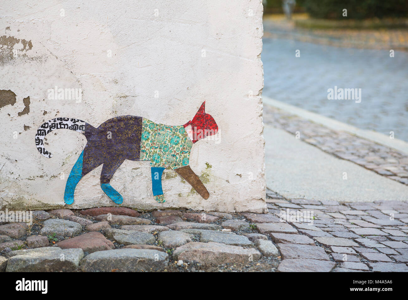Streetart,colorful cat figure on a corner of a house,Torgau,Saxony,Germany Stock Photo