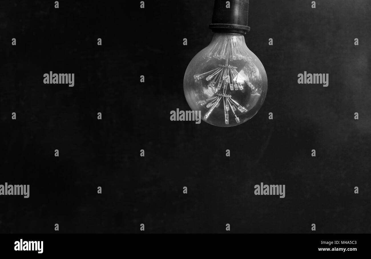 Energy saving LED light bulb on a dark background Stock Photo - Alamy