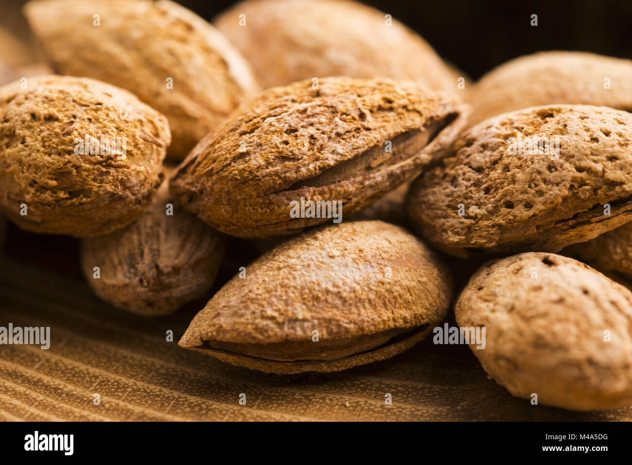 Heap of almond nuts in shell Stock Photo Alamy