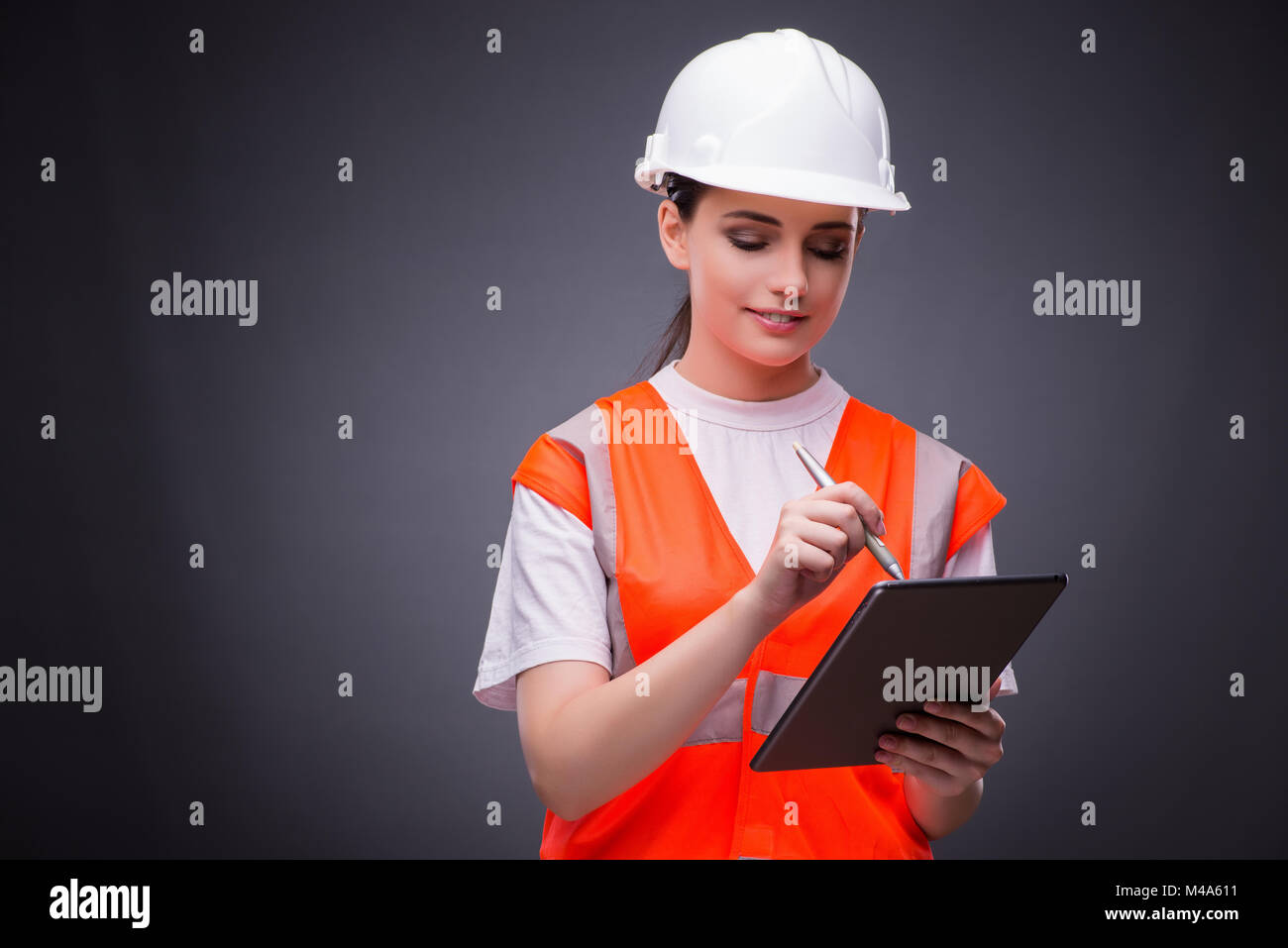 Young construction worker with tablet computer Stock Photo - Alamy