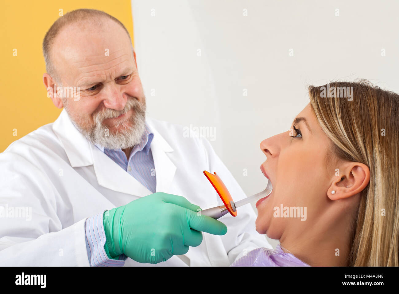 Close up picture of dental polymerization with uv lamp on young female patient Stock Photo Alamy