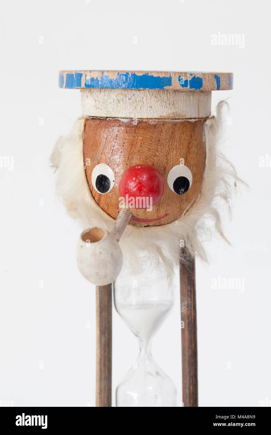 Vintage hour glass kitchen egg timer with old sea dog hires stock