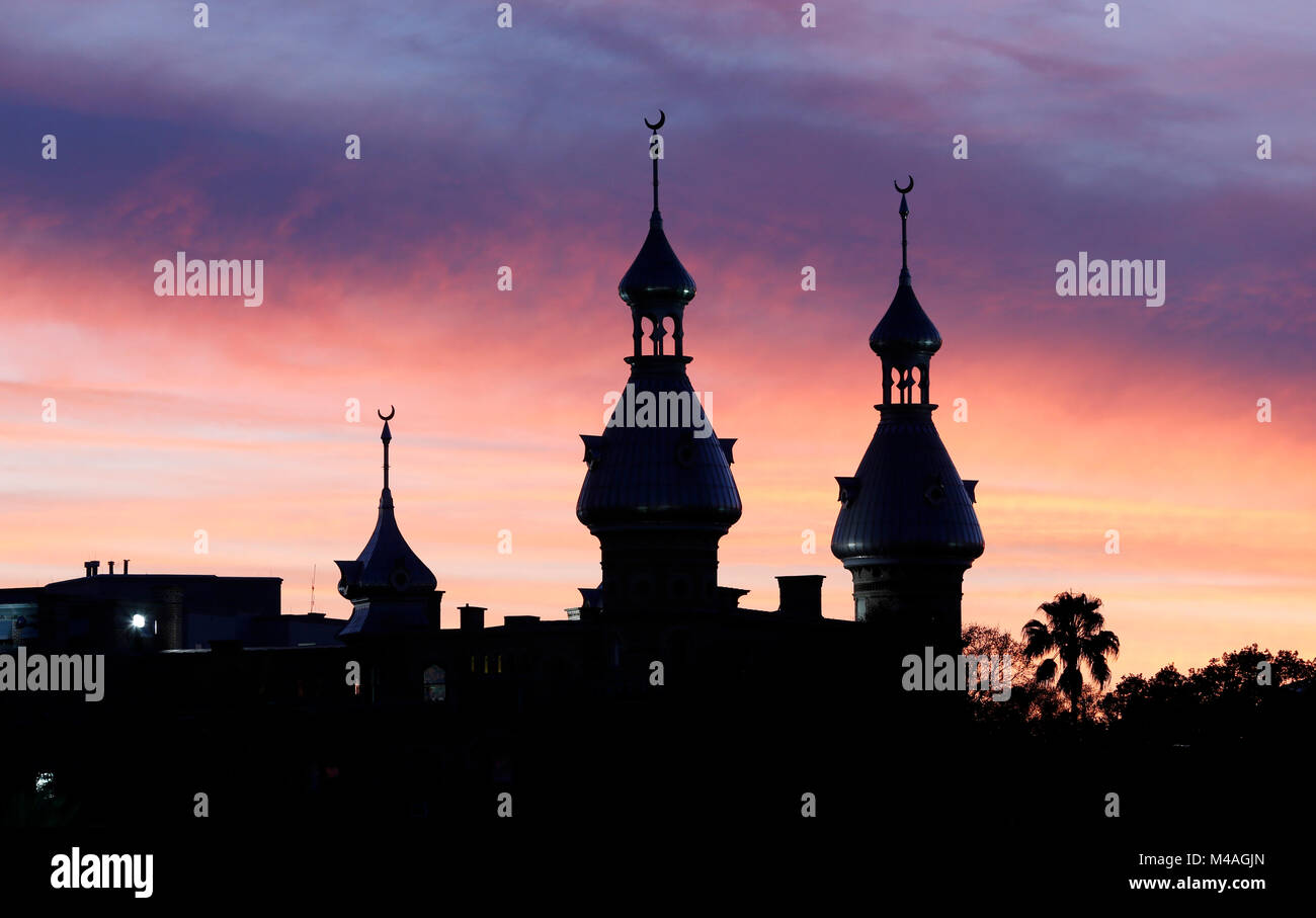 The minarets atop the University of Tampa are silhouetted against the sky just after sunset in downtown Tampa, Florida. Stock Photo