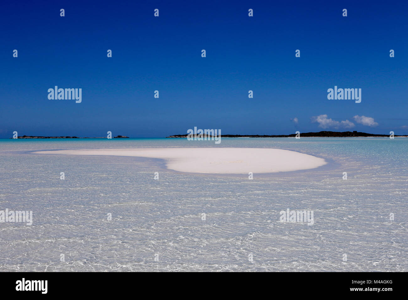 A small sand bar in the clear waters near Man-O-War Cay just off the island of Great Exuma in the Bahamas. Stock Photo