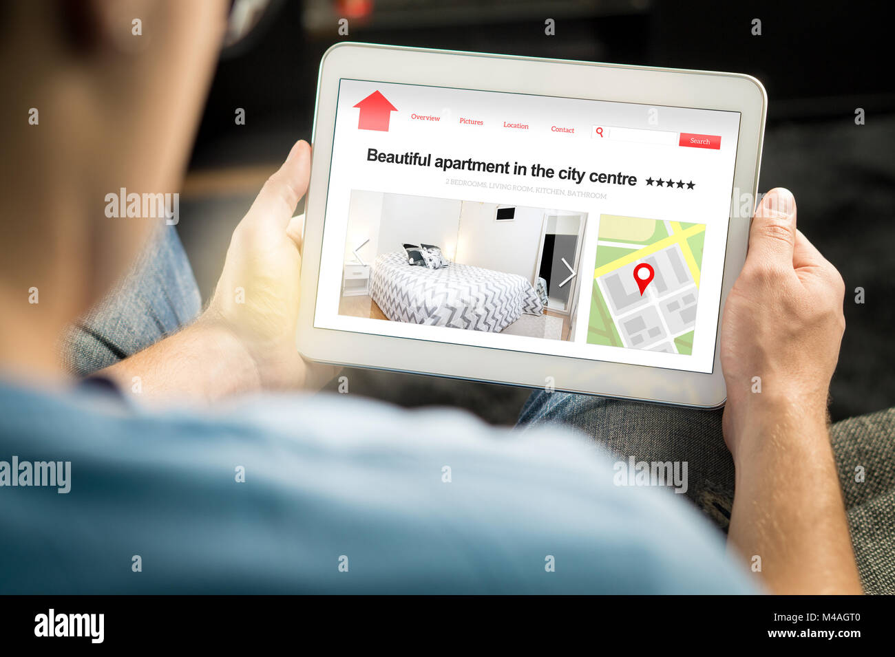 Man search apartments and houses online with mobile device. Holiday home rental or real estate website or application. Imaginary internet marketplace. Stock Photo