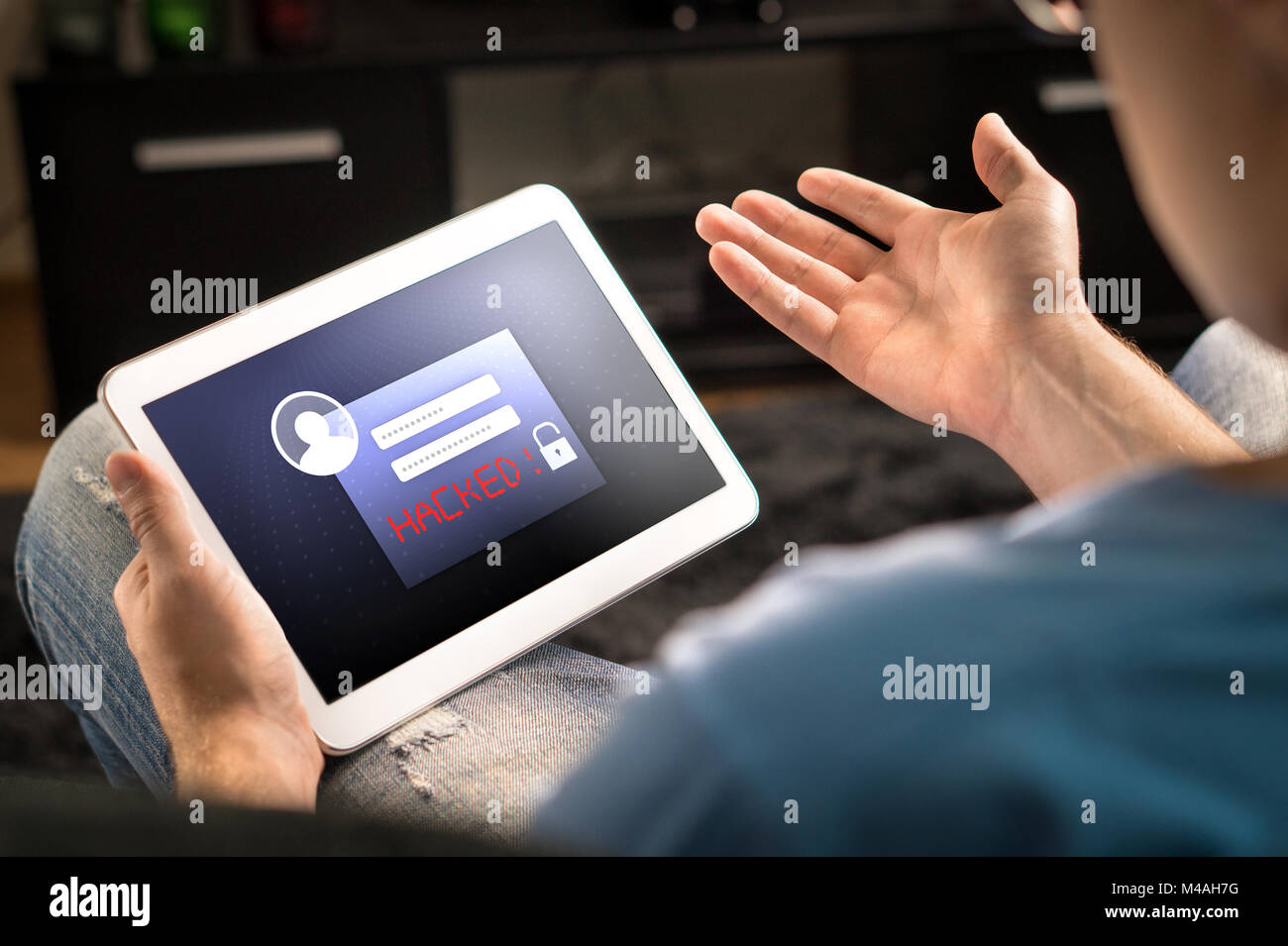 Hacked account on tablet. Cyber security and internet fraud concept. Mobile application login and personal information and data problem. Stock Photo