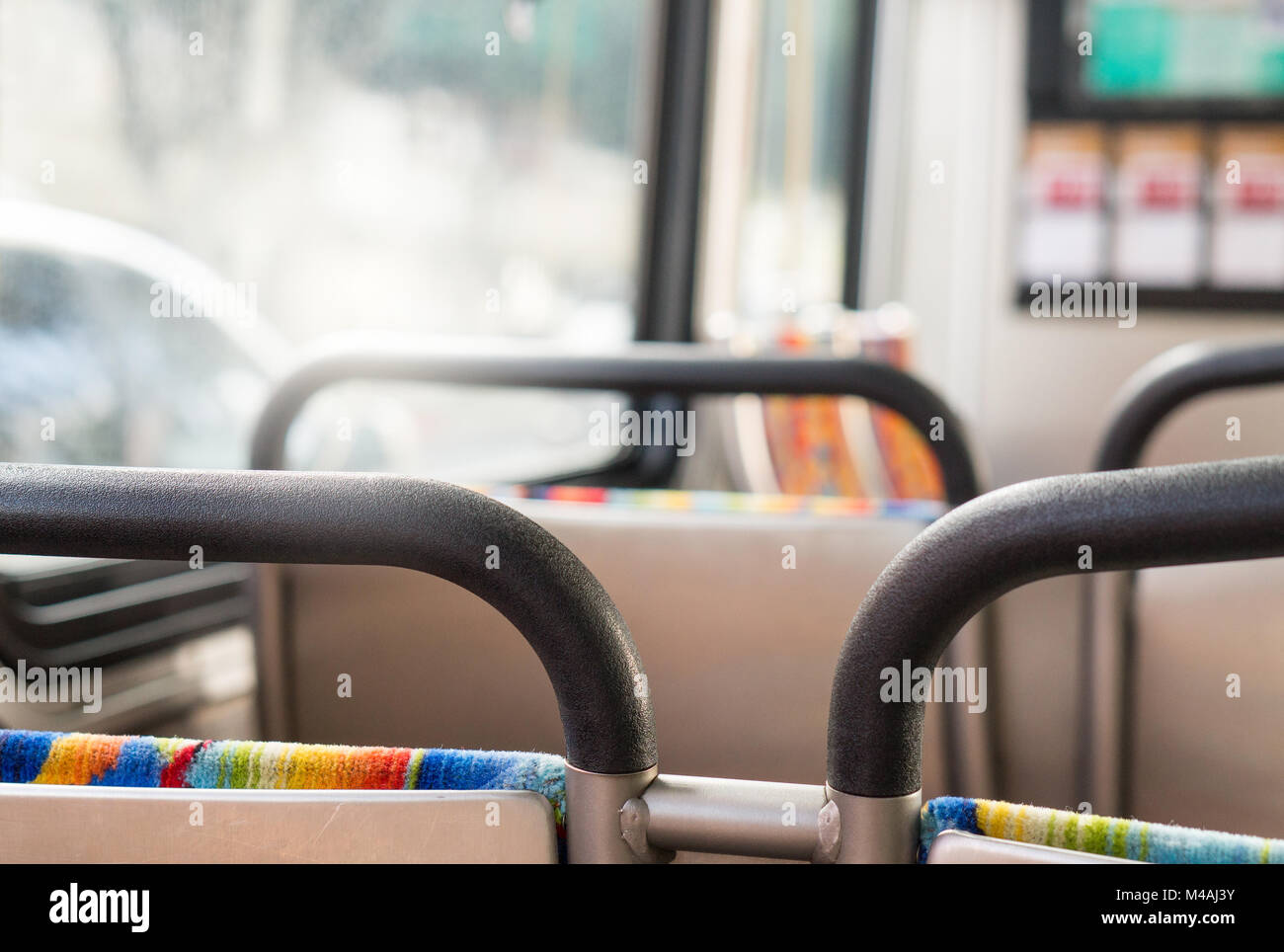 Bus from passengers point ot view. Sitting inside a coach. Public transportation concept with happy vibe. Stock Photo