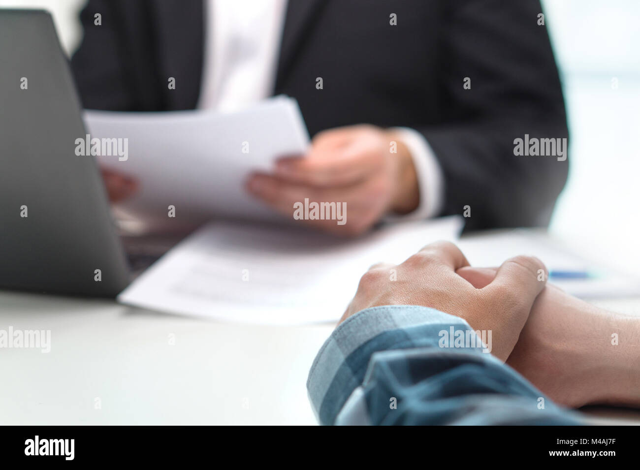 People having meeting in office. Boss with a job applicant in interview. Lawyer with client. Business man or bank worker having discussion about loan. Stock Photo