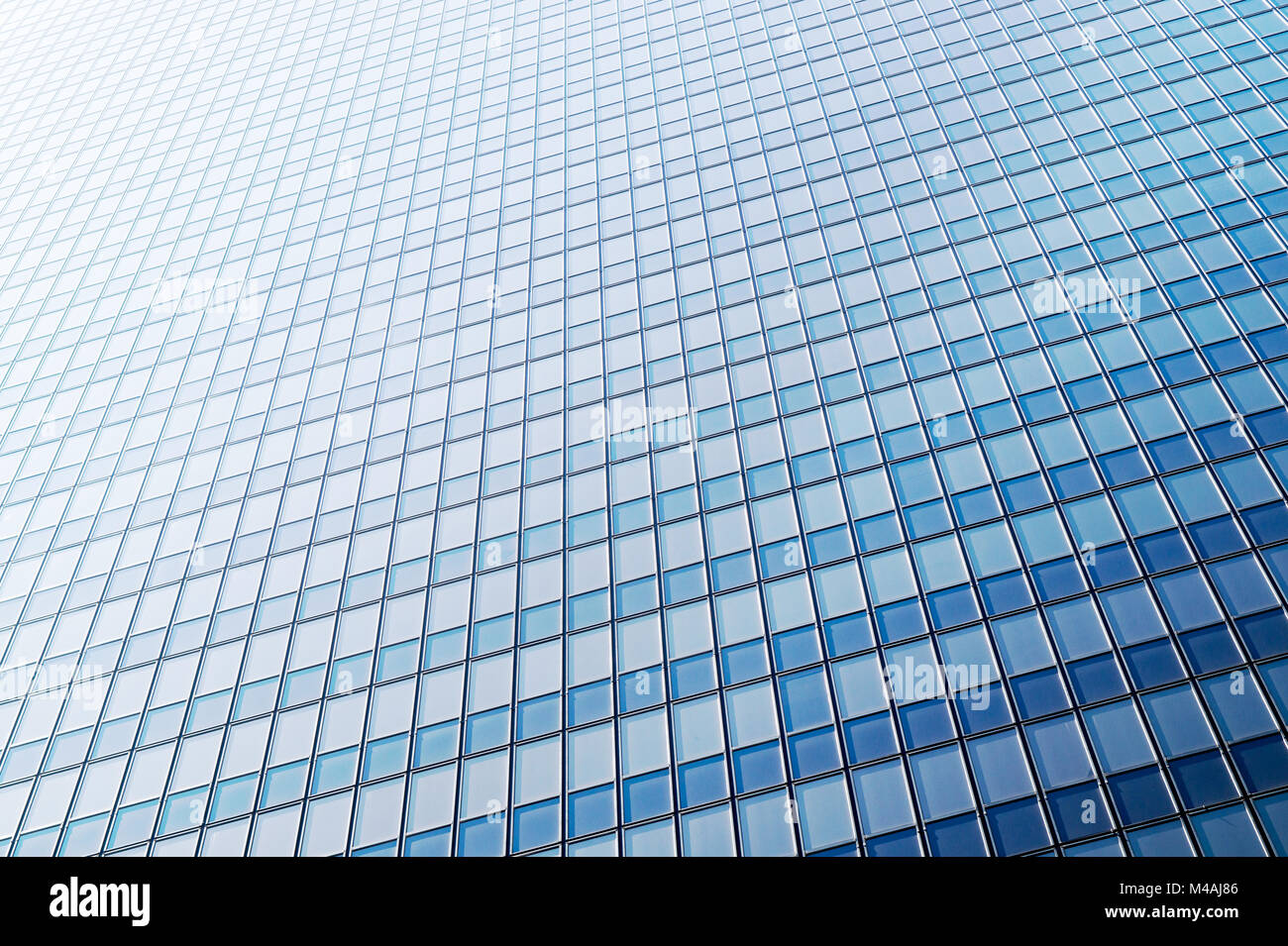 Business office and corporate background. Shiny, new and modern glass building. Window pattern. Stock Photo