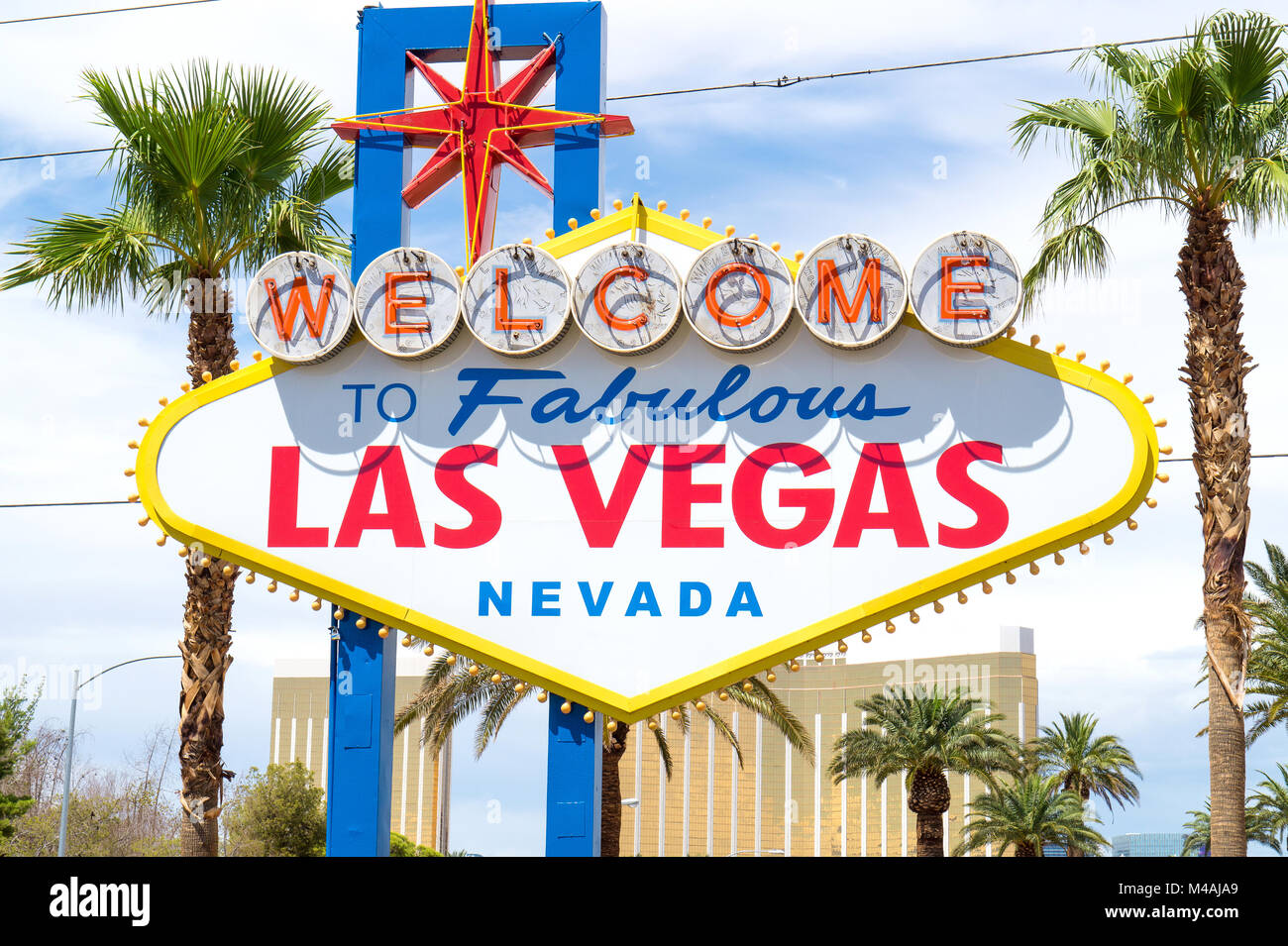 Famous Welcome to Fabulous Las Vegas sign superimposed over view of  southern end of Las Vegas at dawn Stock Photo - Alamy