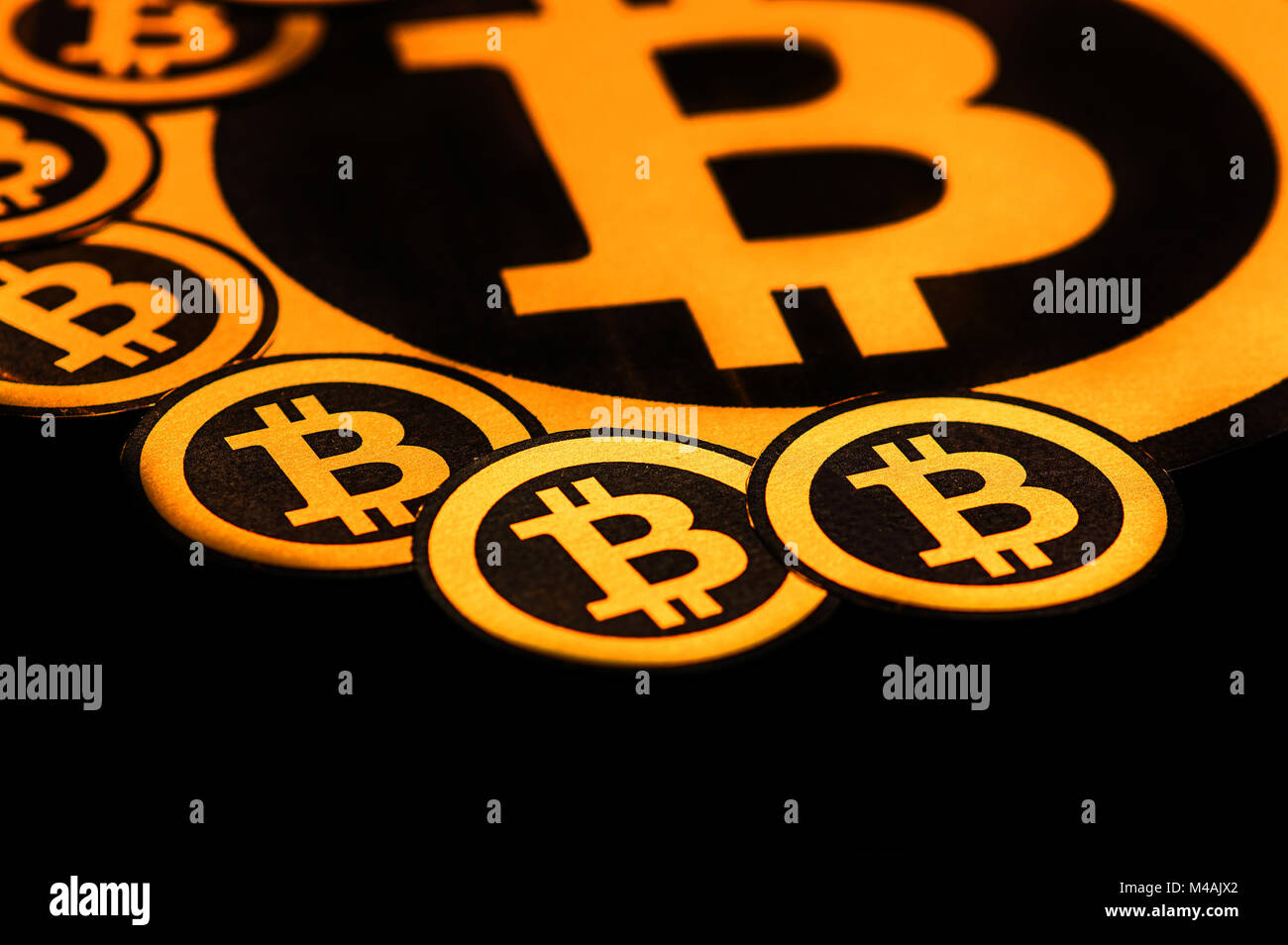 Quito, Ecuador - January 31, 2018: Close up of Golden Bitcoin logo. with  small bitcoins logos around the big one. Bitcoin cryptocurrency. Business  concept in a black background Stock Photo - Alamy