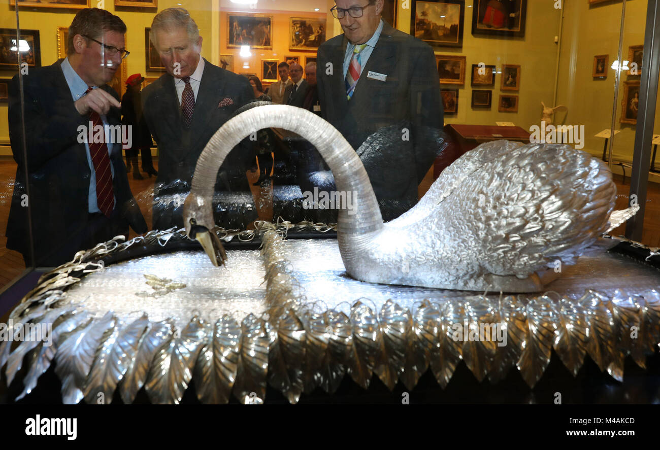 The Prince of Wales (centre) looks at the Silver Swan musical automaton, which dates from 1773, during a visit to the Bowes Museum in Barnard Castle. Stock Photo