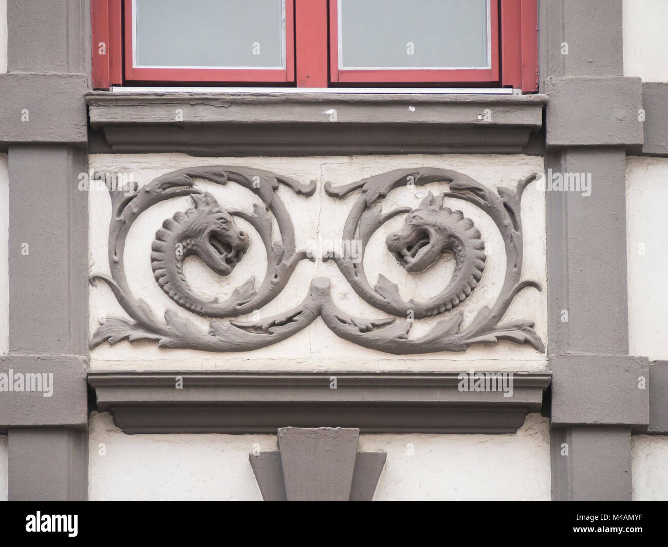 Facade decoration on old apartment block in the St. Hanshaugen district of Oslo Norway, turn of century (ca 1900) building, dragons and leaves Stock Photo