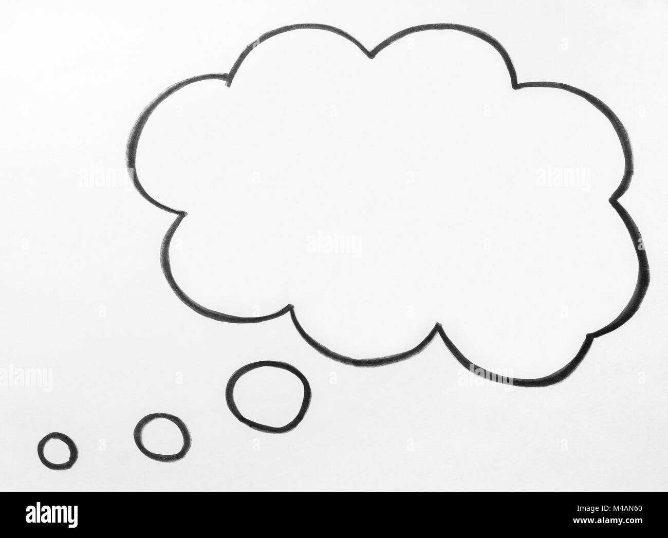 Thought cloud and thinking speech bubble balloon hand drawn on paper. Stock Photo