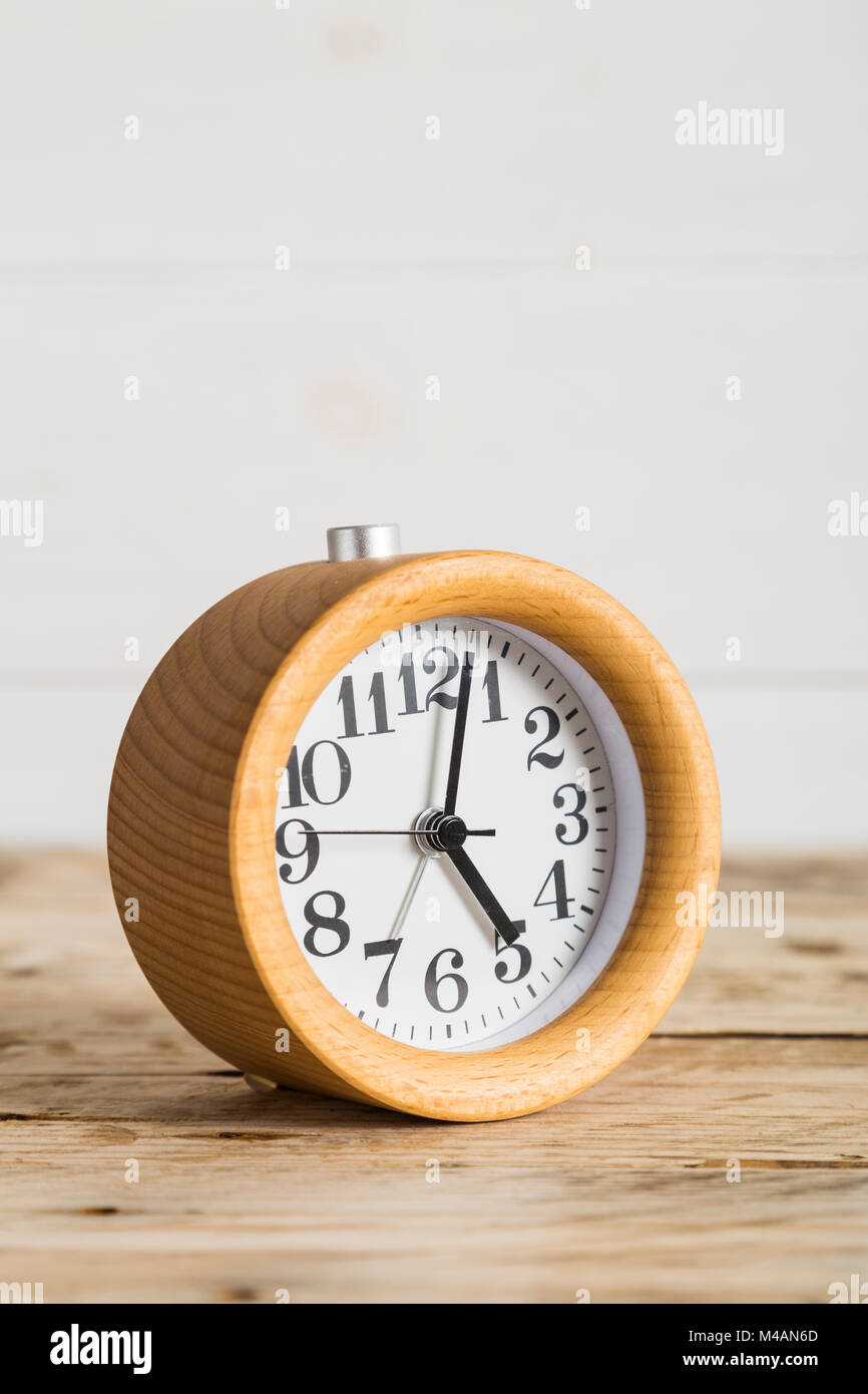 Wooden bedside alarm clock Stock Photo