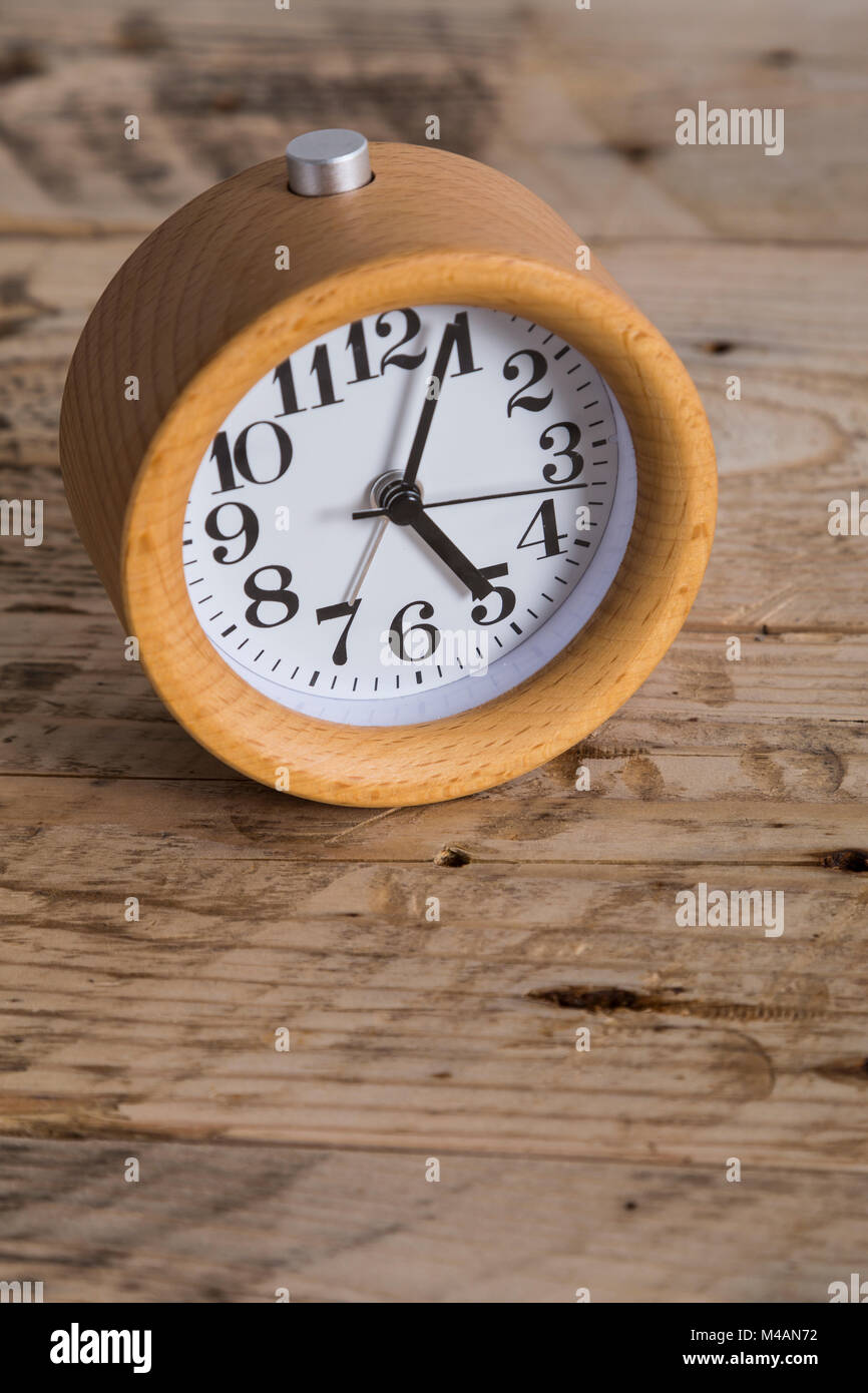 Wooden bedside clock Stock Photo