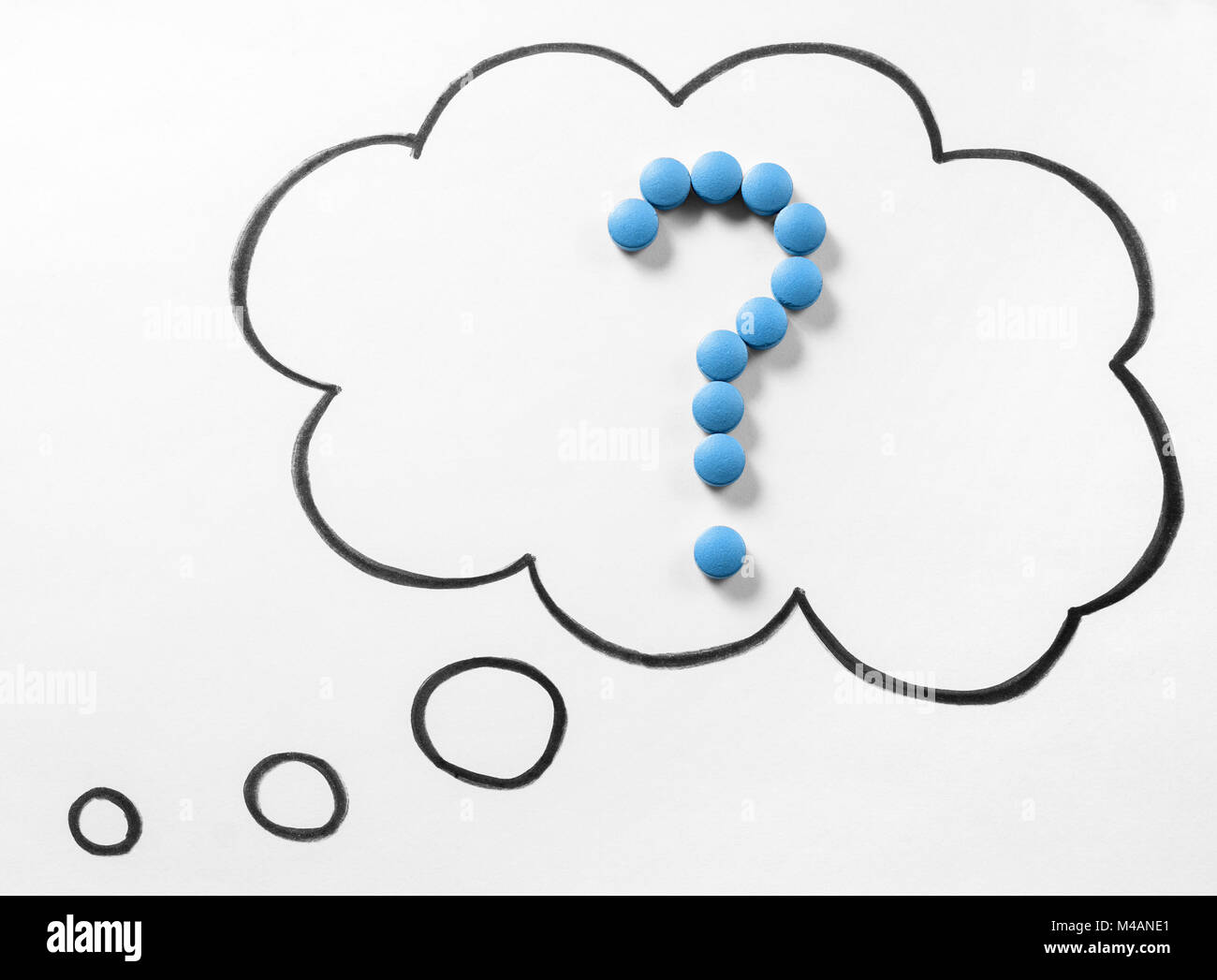 Wondering medical issues or no idea about correct medication or drug. Question mark from pills in thinking speech bubble and thought cloud hand drawn. Stock Photo