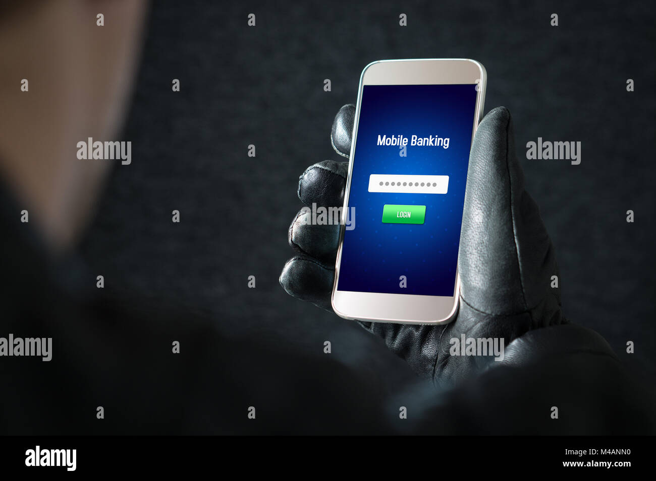 Mobile banking hack and cyber security concept. Hacker and criminal login to persons online bank application and steal money from account. Stock Photo