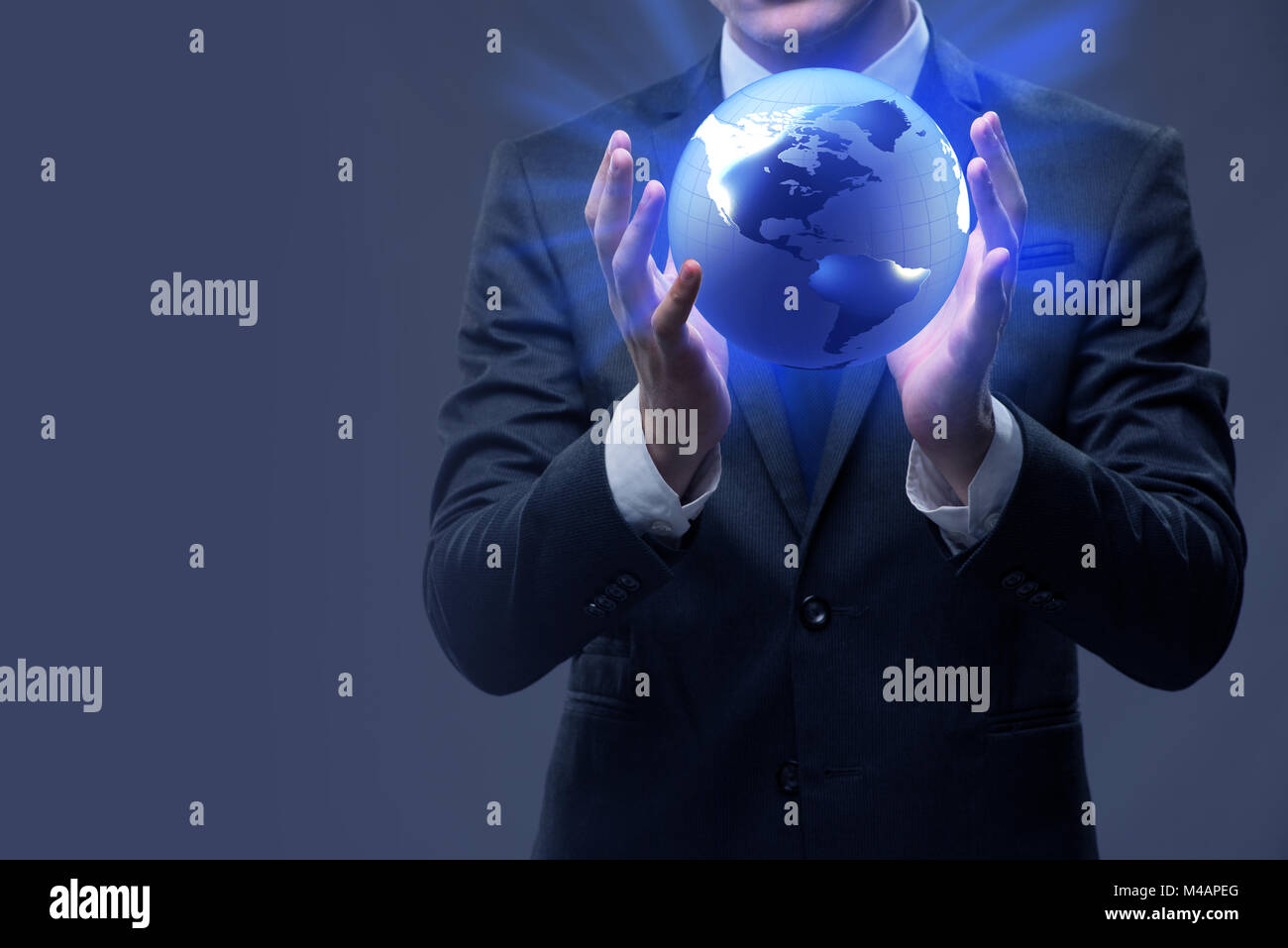 Businessman holding globe in global business concept Stock Photo - Alamy