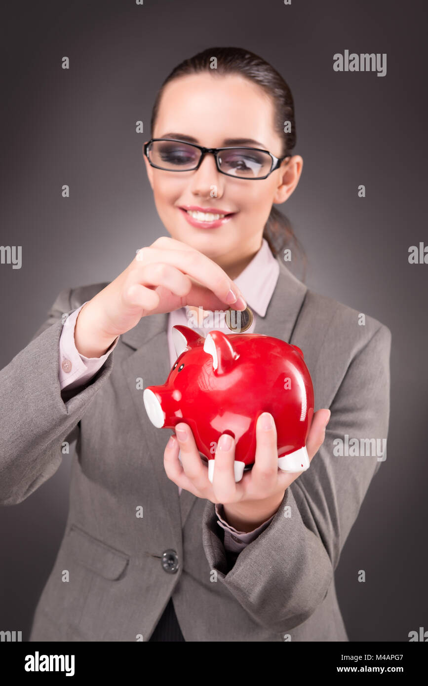 Business concept with businesswoman and piggy bank Stock Photo - Alamy