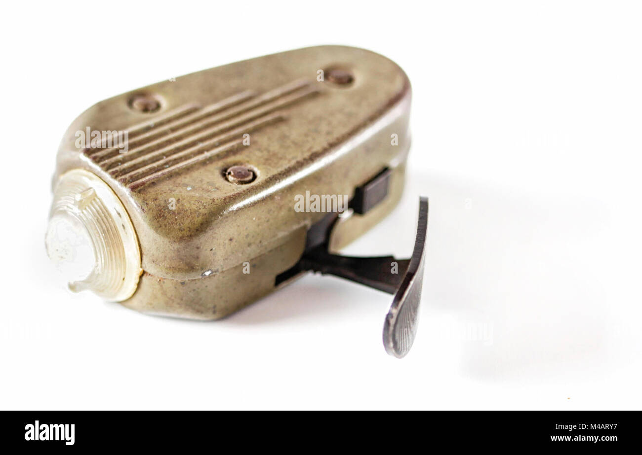 Historical hand driven mechanically powered torch light used before and during the second world war. Stock Photo
