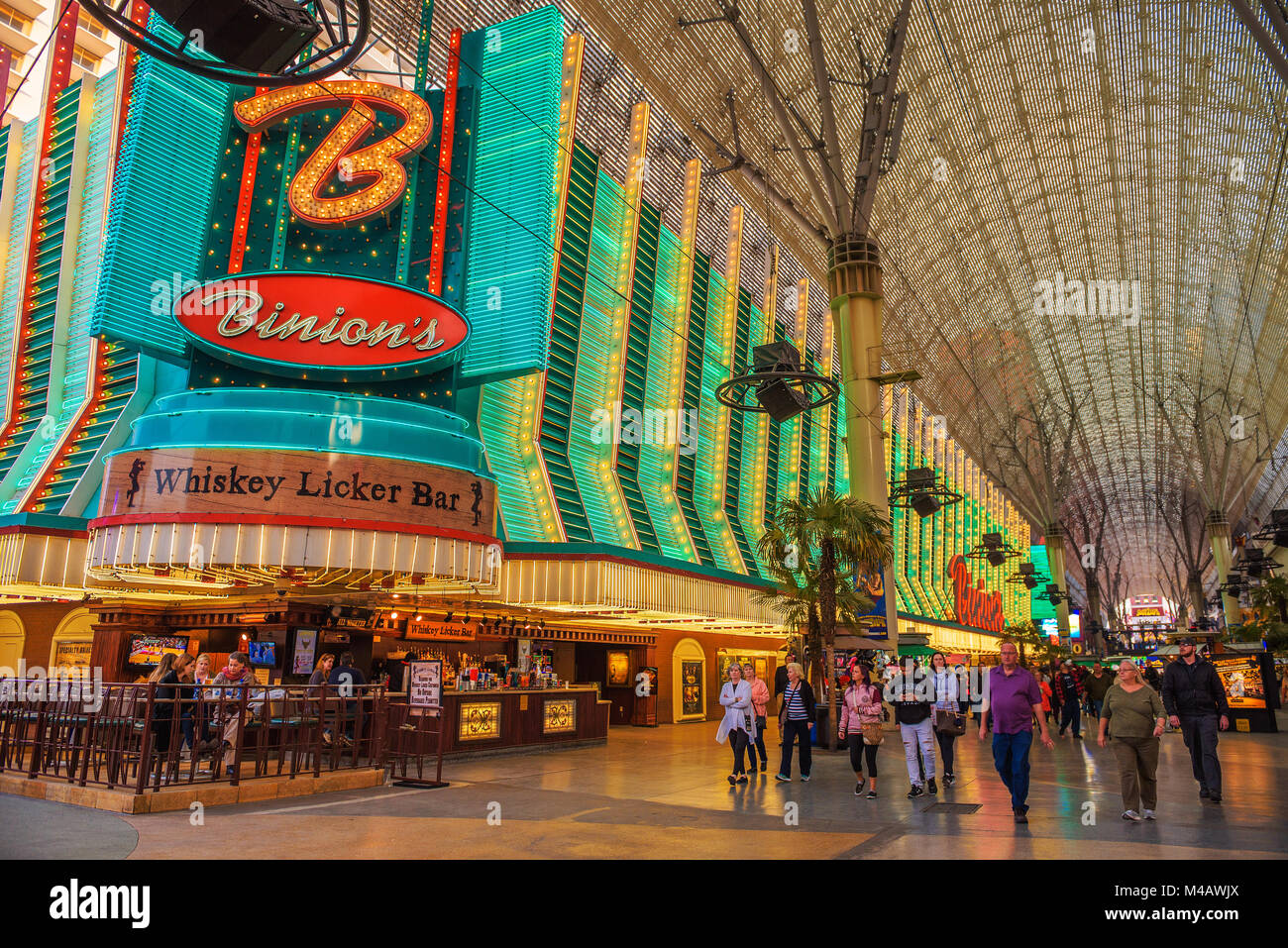 Fremont Street with many neon lights and tourists in Las Vegas Stock Photo