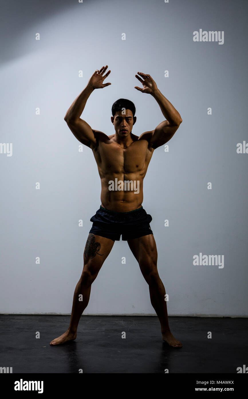 An Asian fitness model full body shot looking directly at the camera Stock  Photo - Alamy