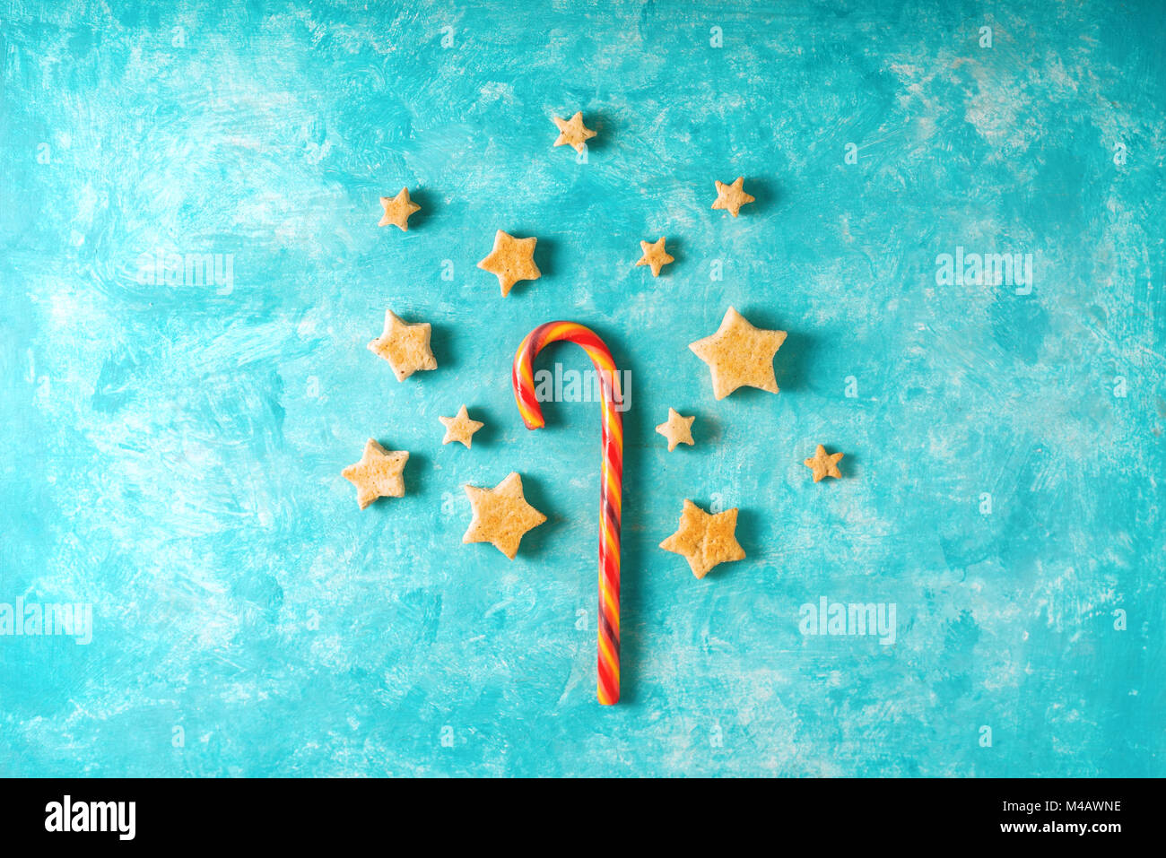 Christmas candy and cookies on the blue background top view Stock Photo