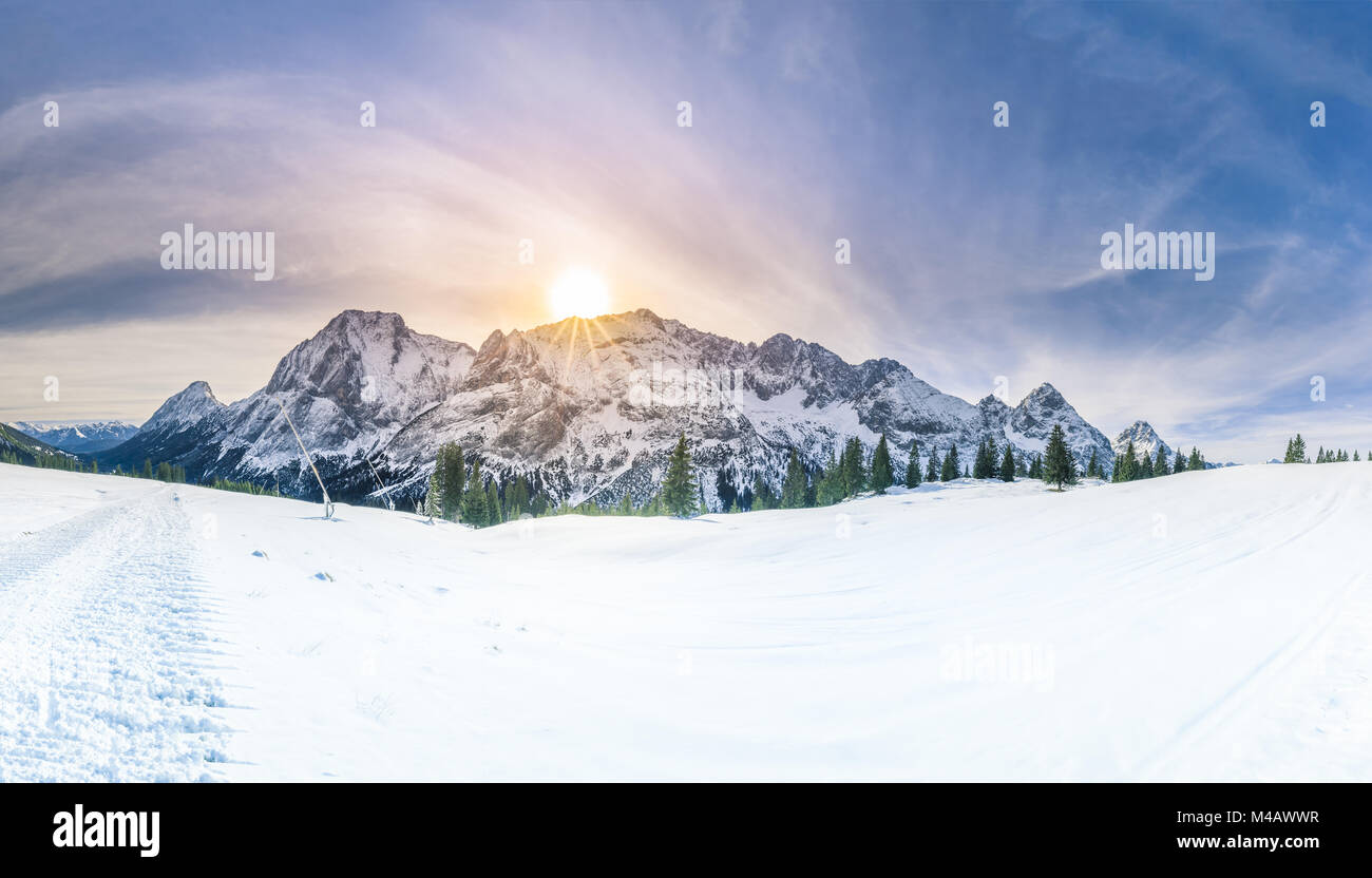 Winter sunshine over snowy mountains Stock Photo - Alamy