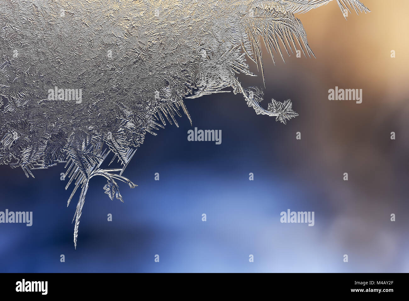 Winter patterns of ice on the window glass - macro Stock Photo - Alamy