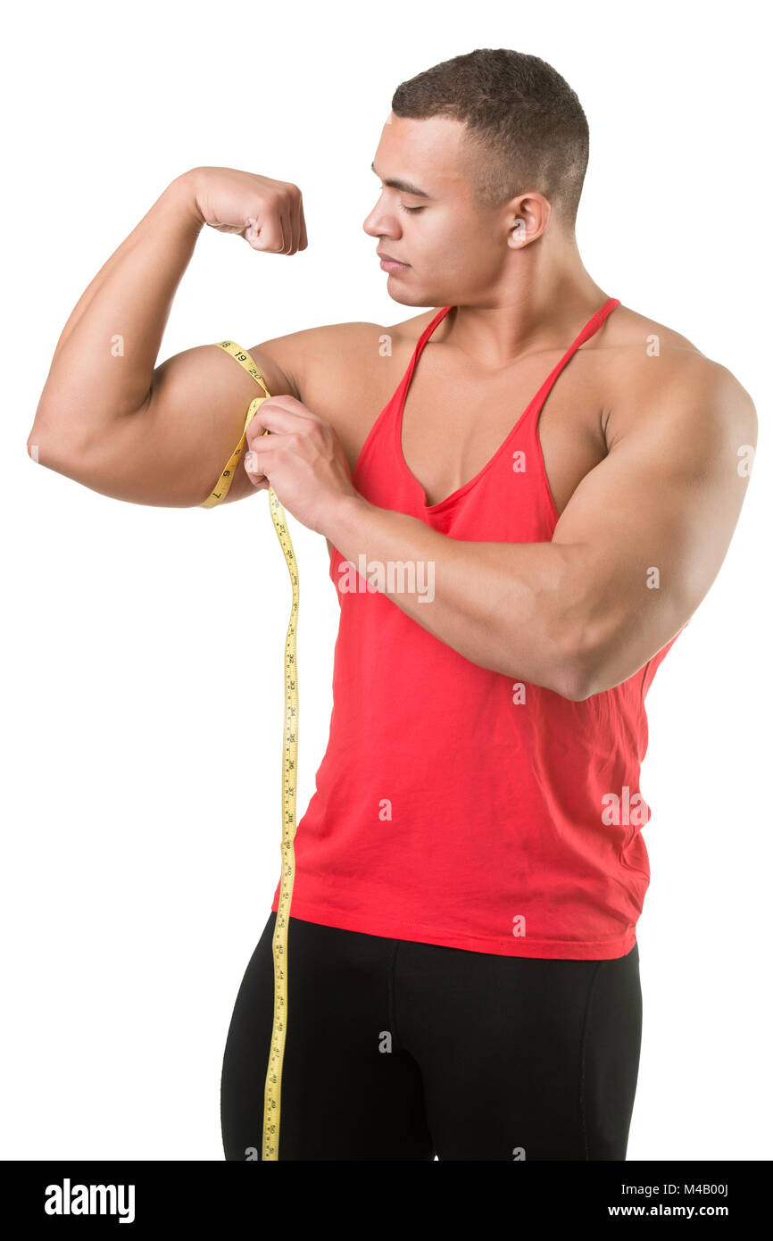 Close-up of a man measuring his biceps with a tape measure Stock Photo -  Alamy