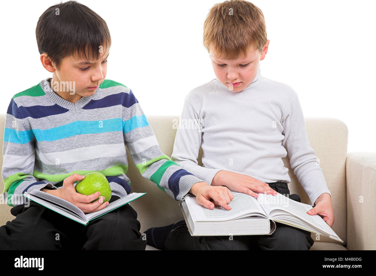 Boy sitting reading big book hi-res stock photography and images - Alamy