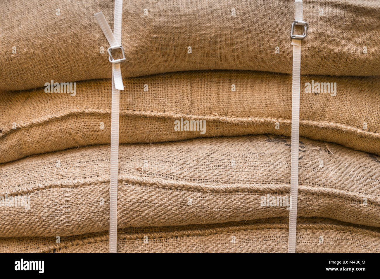 Background of stacked burlap sacks Stock Photo Alamy