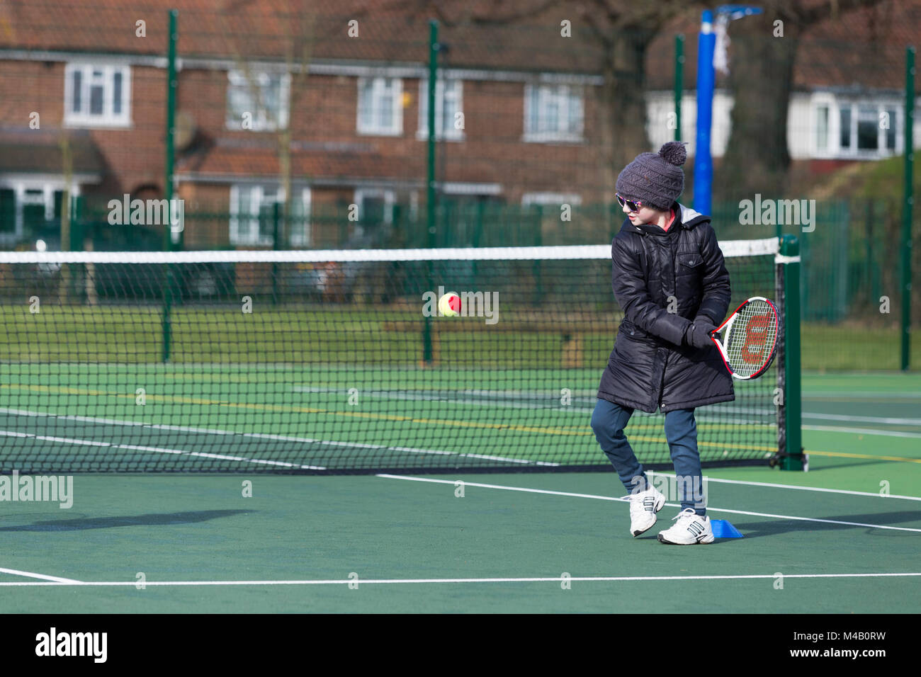 Children S Tennis Coaching Session Lesson Taking Place On A