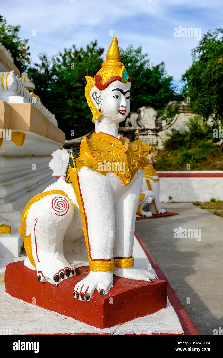 The sculpture of a woman with a lions body as guard of a Pagoda on top