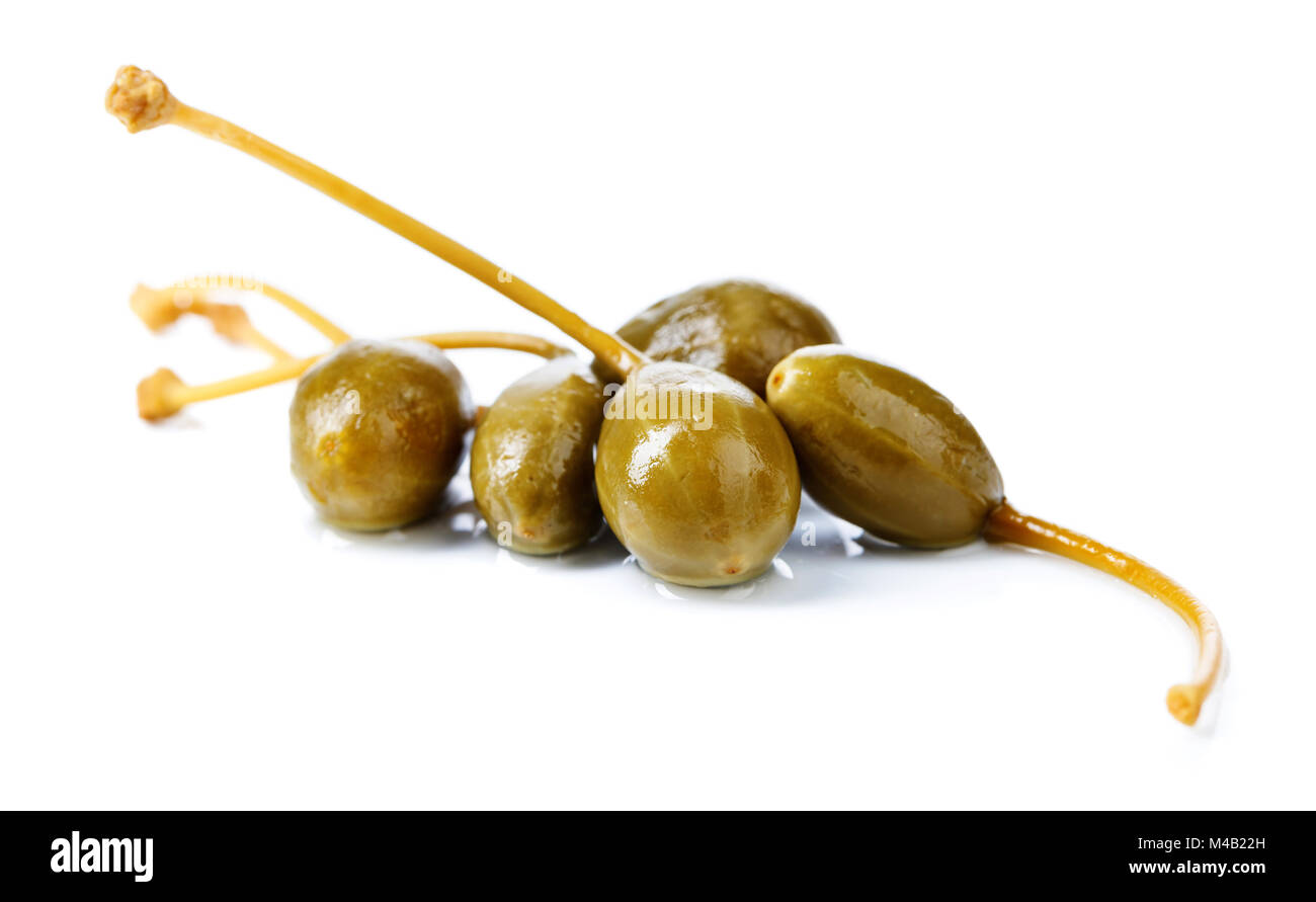 Pickled caper berries isolated on white background . Edible fruits of