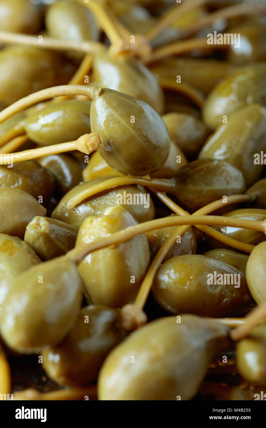 Pickled caper berries . Edible fruits of Capparis . Berries are used as
