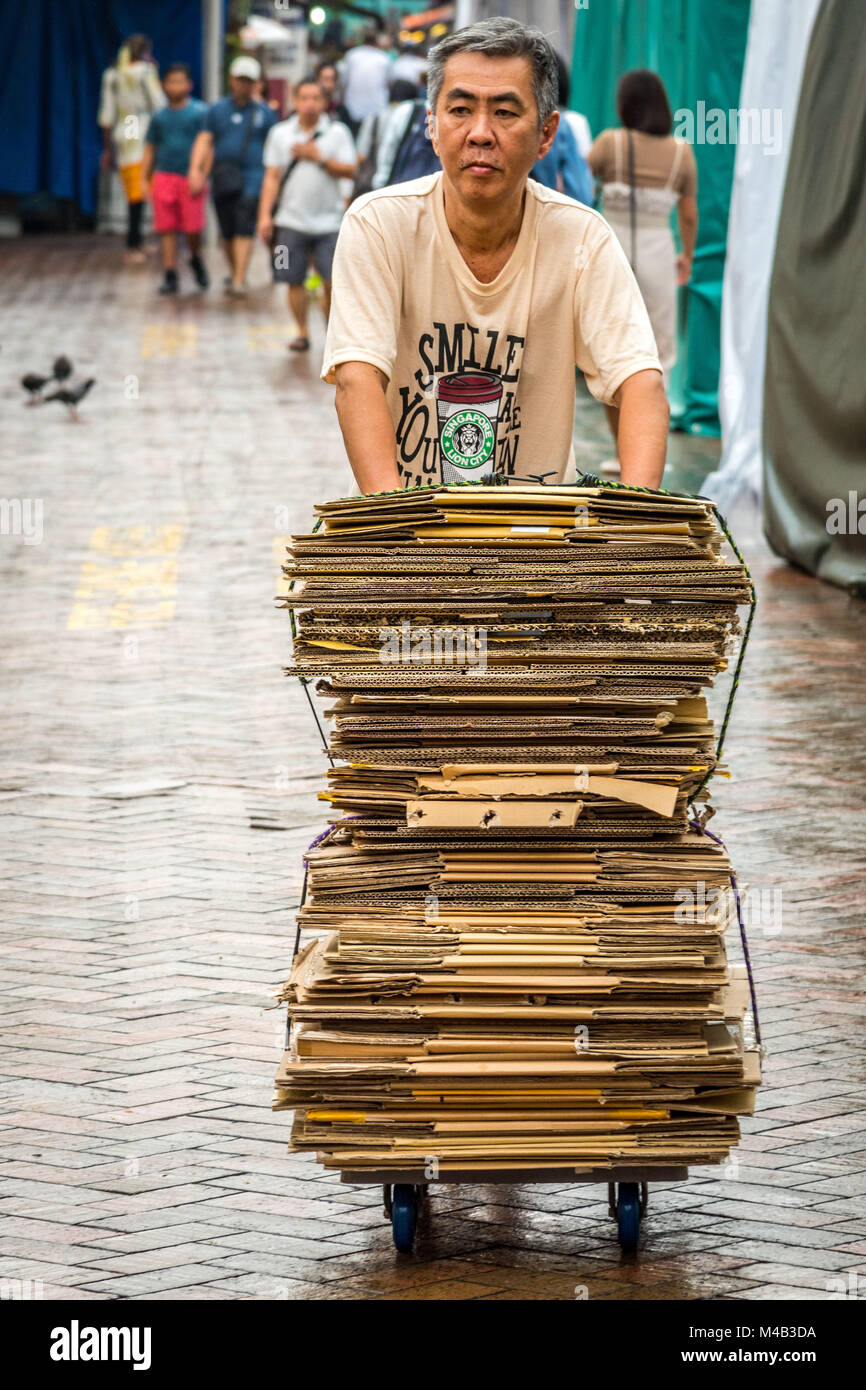 Older man collects cardboard packagings in Chinatown,Singapore Stock ...