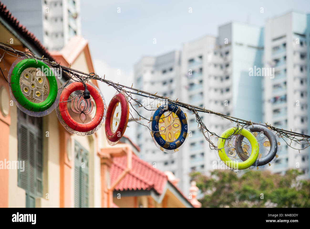 Traditional street decoration in Little India in contrast to the modern high rises in Singapore Stock Photo