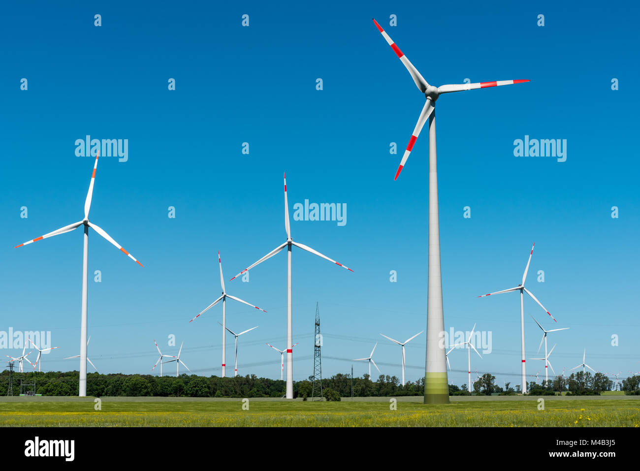 Wind energy plants on a sunny day seen in rural Germany Stock Photo