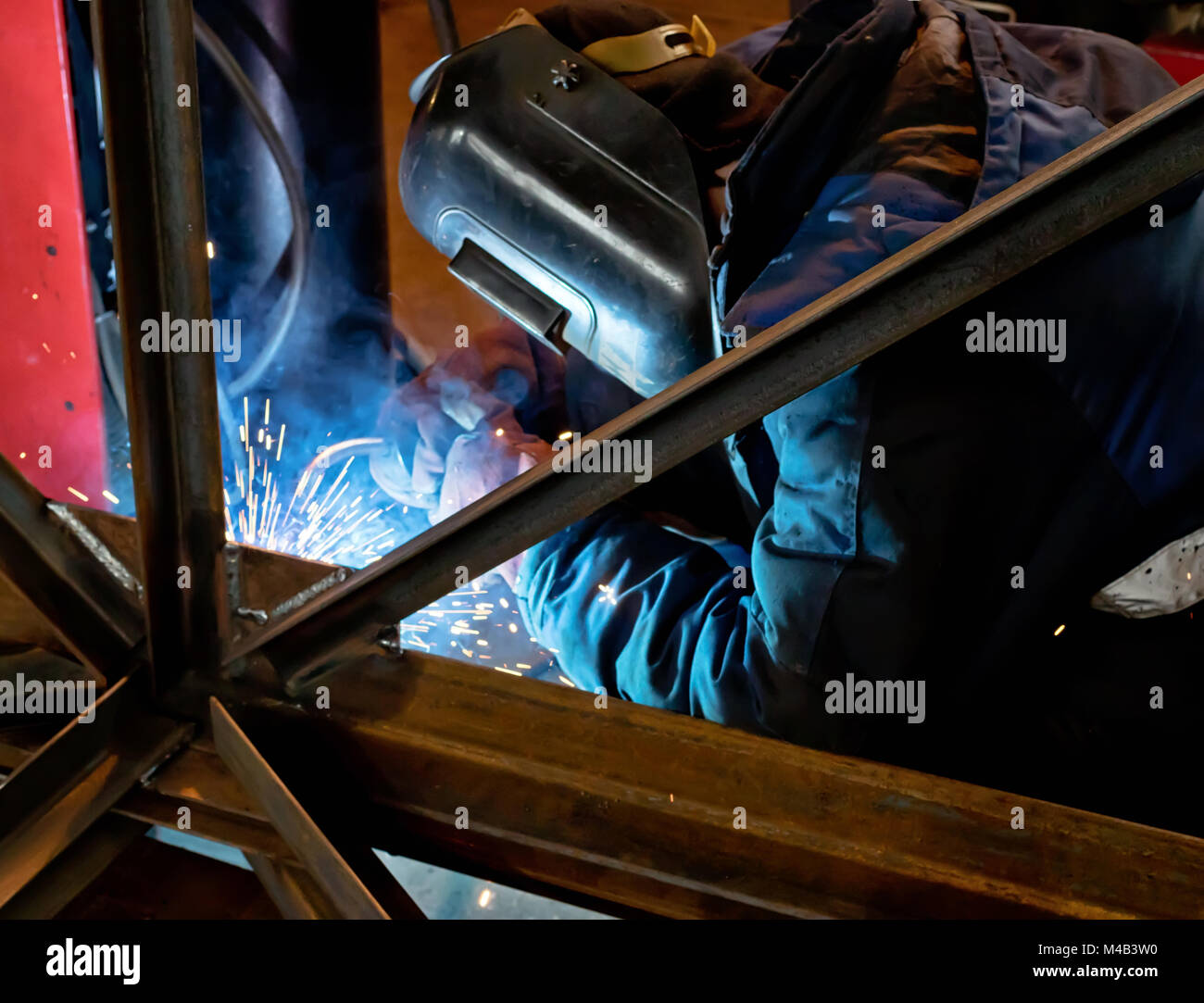 Semi-automatic welding of metal structures in the shop Stock Photo