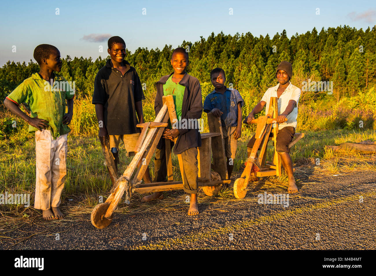 Local boys on their self made bicycles,Malawi,Africa Stock Photo