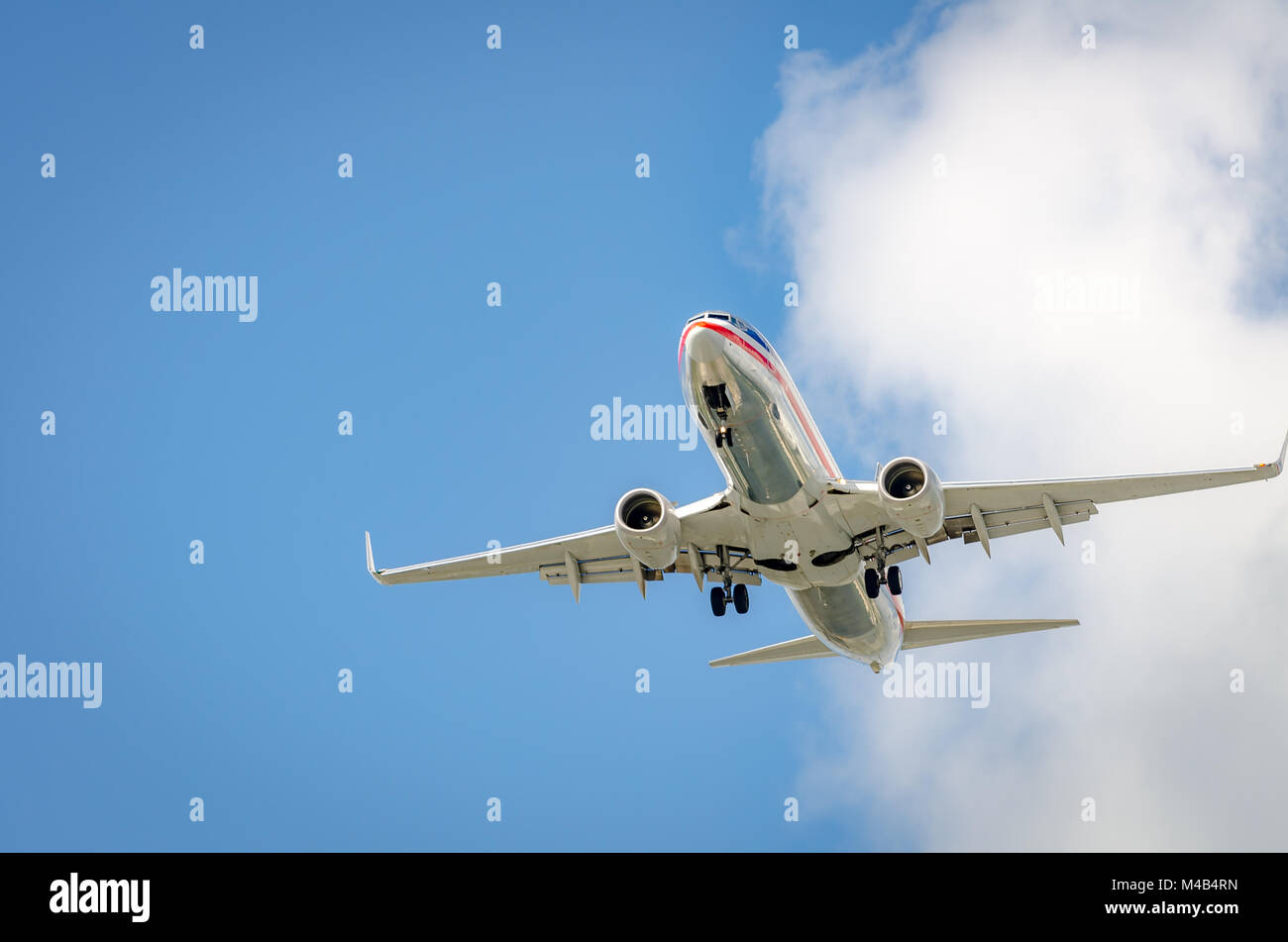 Airplane approaching the airport and landing in Miami Stock Photo - Alamy