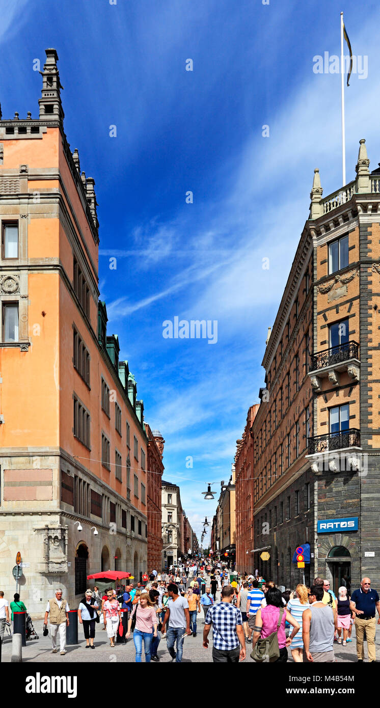 Stockholm / Sweden - 2013/08/01: Norrmalm district view from Old town quarter Gamla Stan and Drottninggatan street - main shopping passage Stock Photo