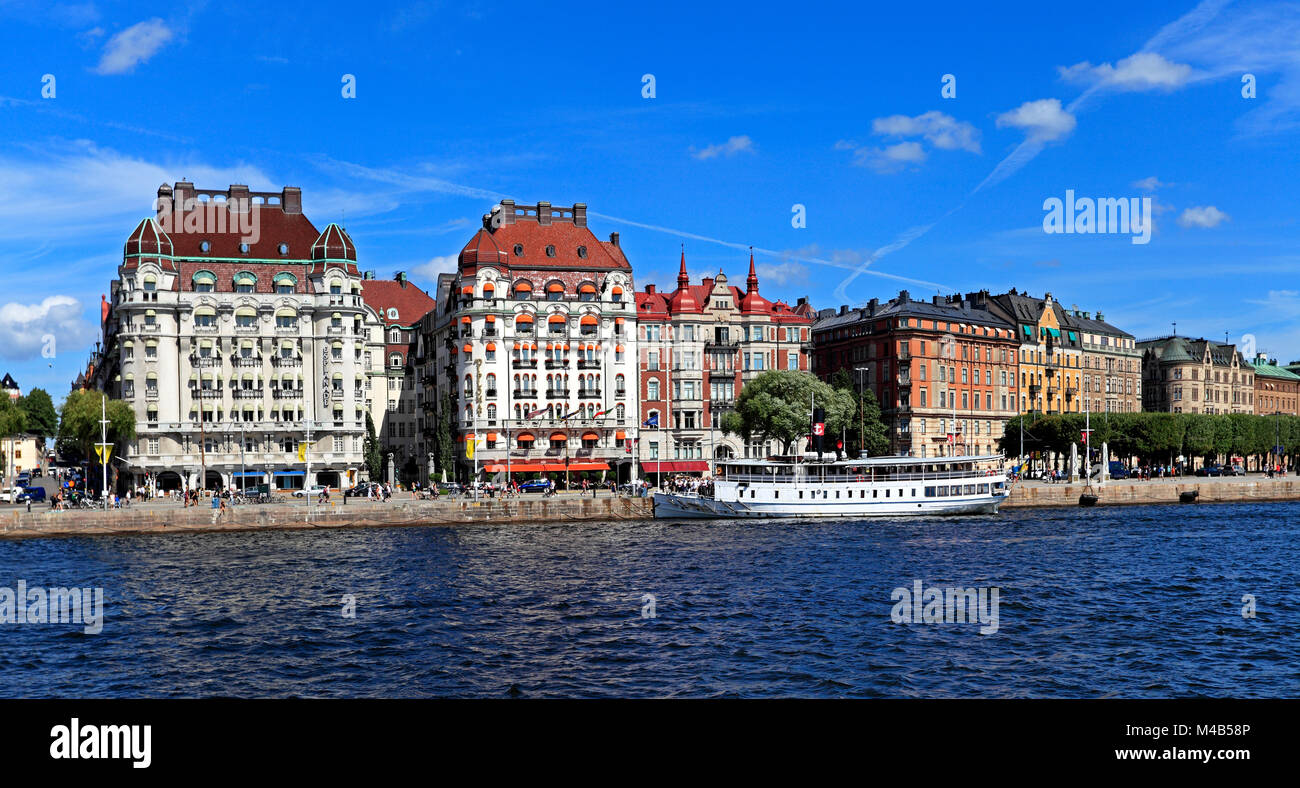 Stockholm / Sweden - 2013/08/01: Norrmalm district view from Old town quarter Gamla Stan - Baltic sea harbor piers and most prominent shoreline reside Stock Photo