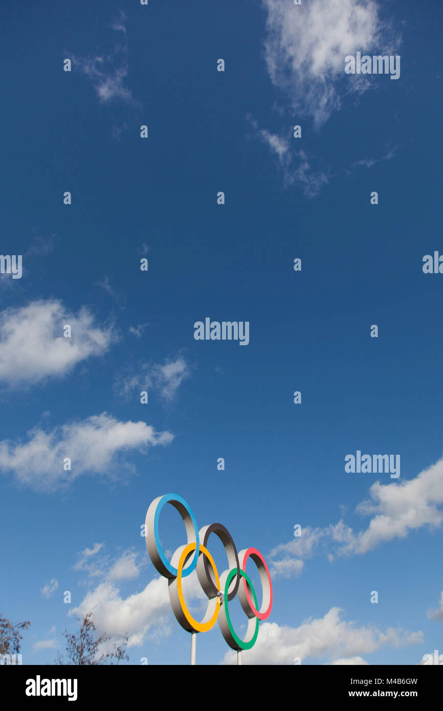 LONDON, UK - February 15th 2018: The Olympic symbol, made up of five interconnected coloured rings, under a blue sky Stock Photo