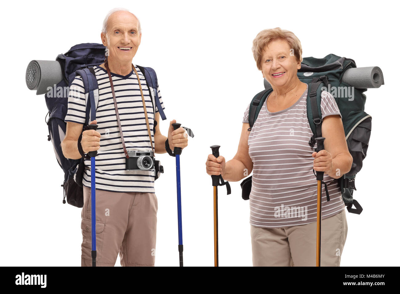 Elderly hikers looking at the camera and smiling isolated on white background Stock Photo